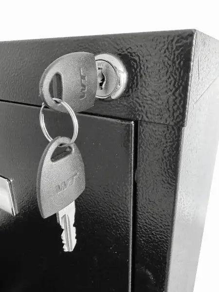Keys hanging from a lock cylinder.