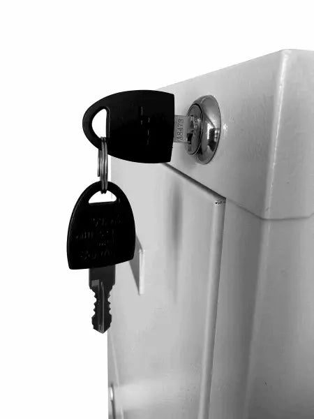 Car key hanging from a lock cylinder