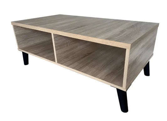 Modern coffee table with open shelving compartments and black legs.
