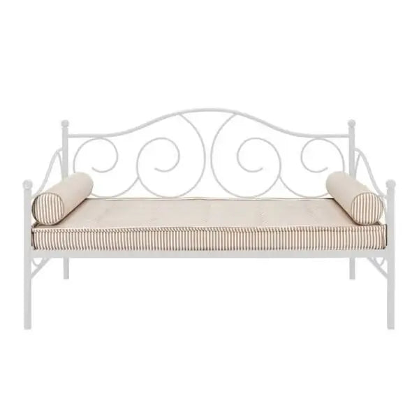White metal daybed with scrollwork headboard and striped cushioning