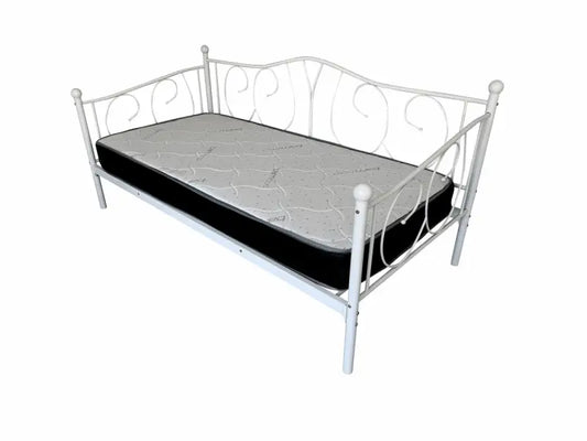 White metal daybed with scrollwork details and a black mattress
