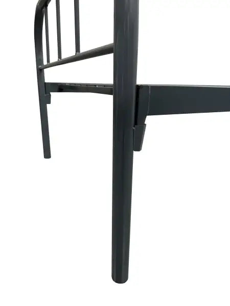 Black metal chair leg with support bars.