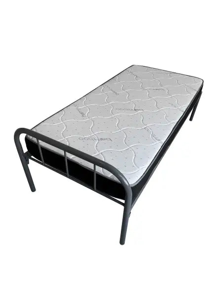 Basic metal frame bed with a quilted mattress