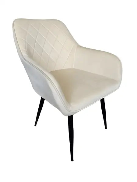Cream-colored quilted armchair with black tapered legs