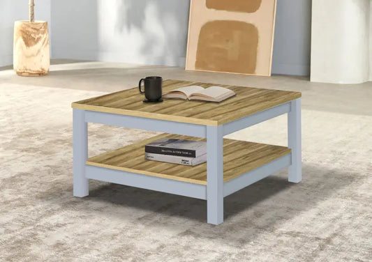 Square coffee table with white legs and natural wood top and bottom shelf.