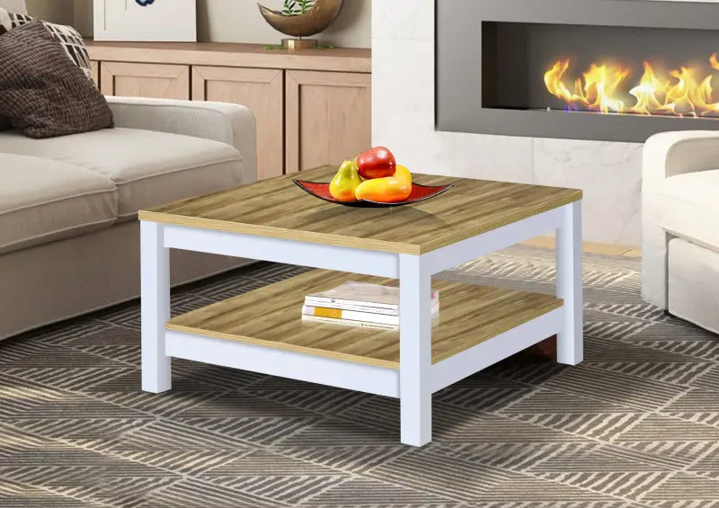 Square coffee table with white legs and natural wood top and bottom shelves